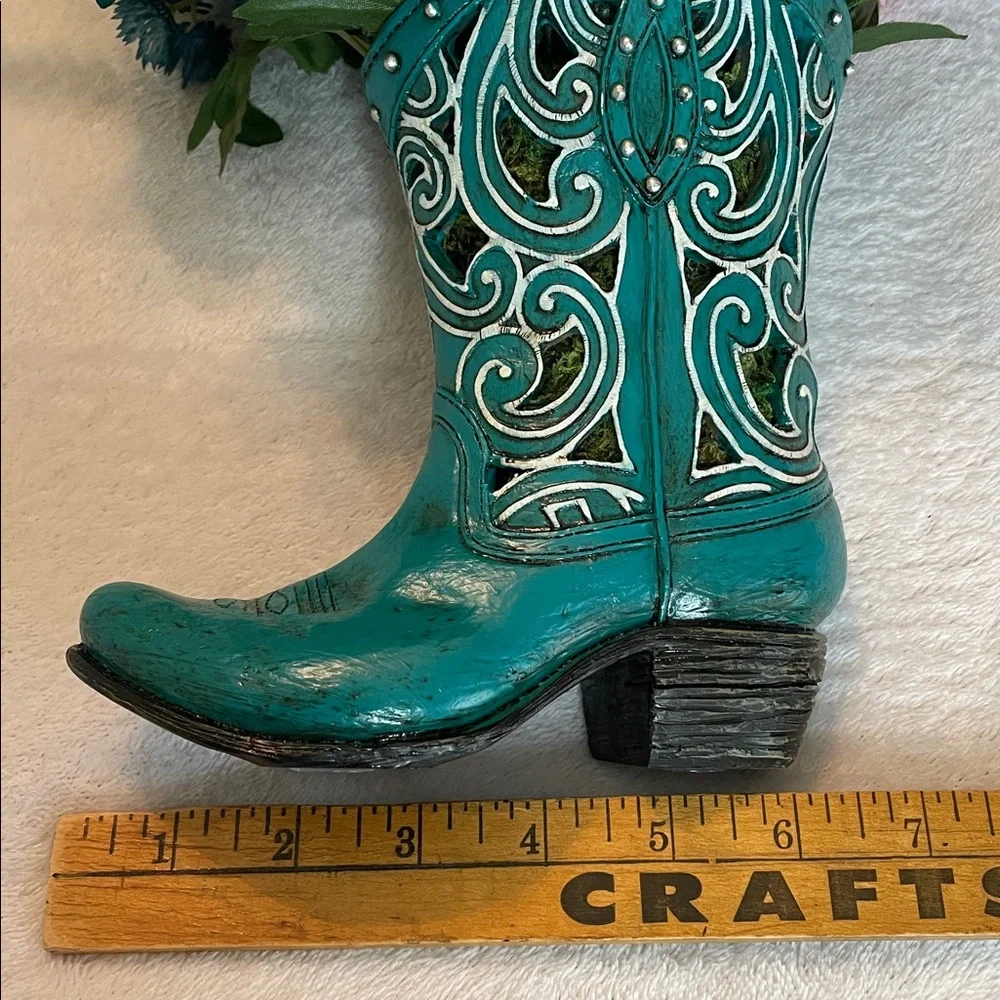Cute colorful silk arrangement in a resin decorative boot. 🌺